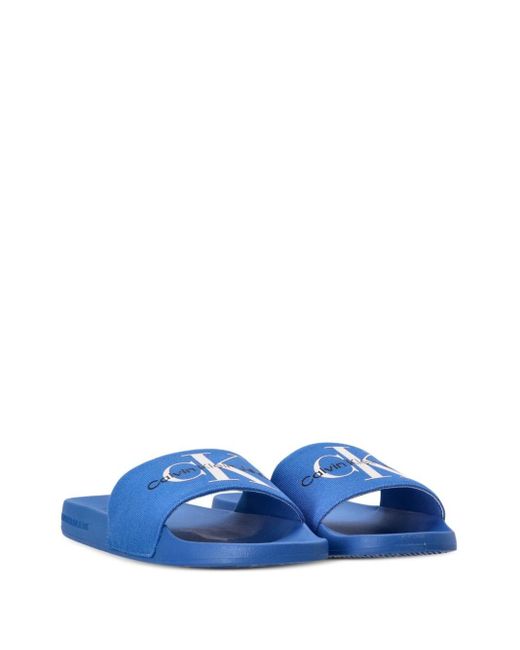 Claquettes à logo imprimé Calvin Klein pour homme en coloris Blue