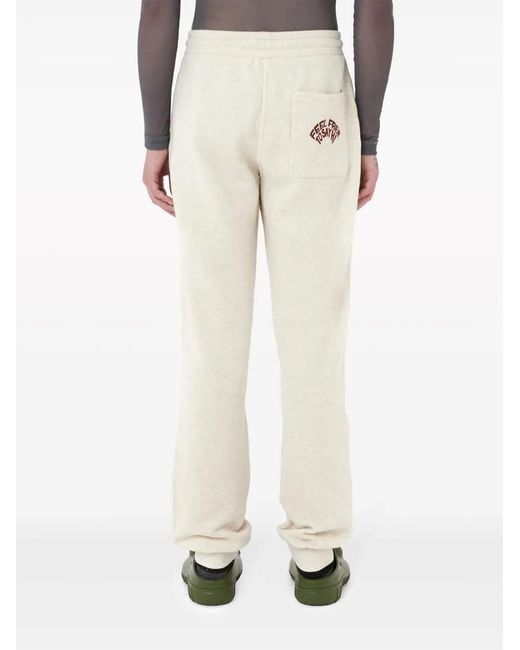 J.W. Anderson Natural Slogan-Embroidered Cotton Track Pants for men