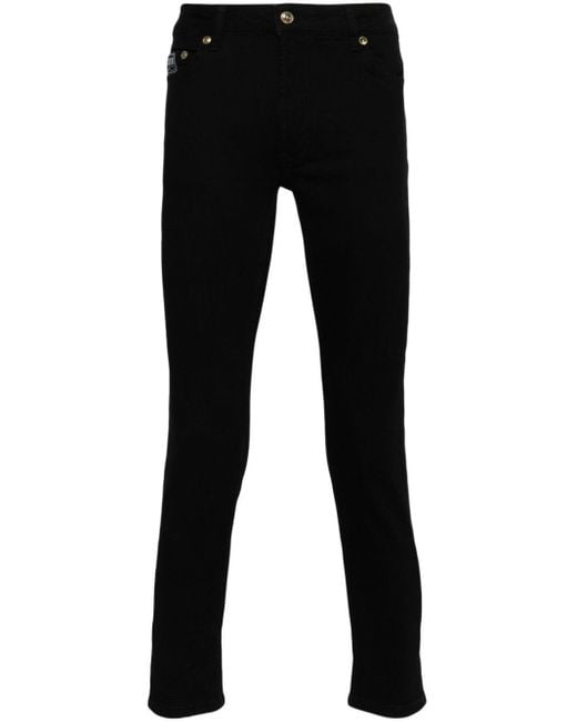 Jean skinny à taille basse Versace pour homme en coloris Black