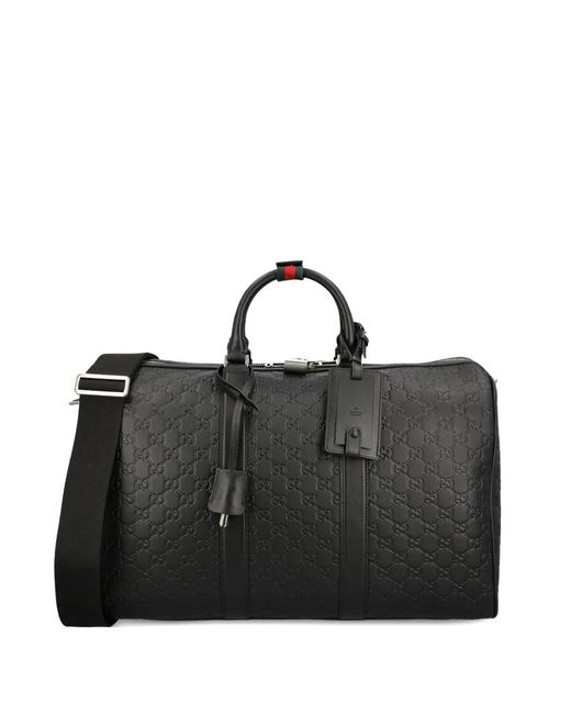 Gucci Black Medium Gg Emblem Embossed Holdall for men