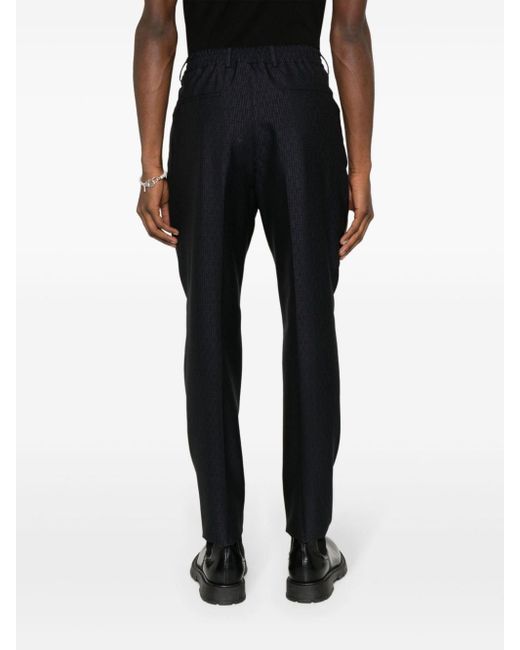 Pantalones tapered con motivo FF Fendi de hombre de color Black