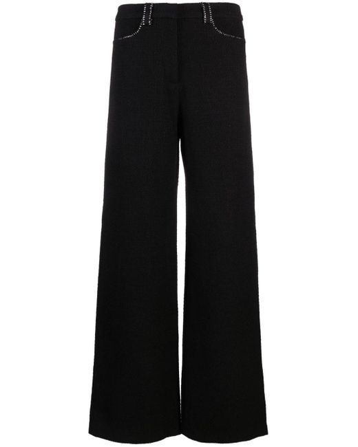 Pantalones de tweed con detalle de cadena Maje de color Black