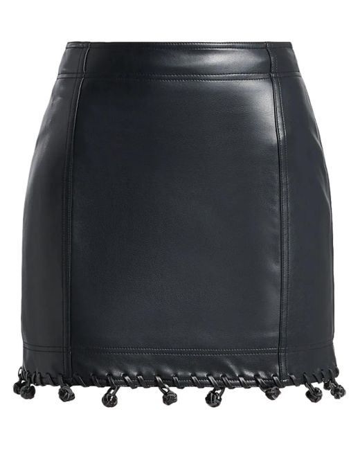 Falda corta con detalle de nudo Aje. de color Black