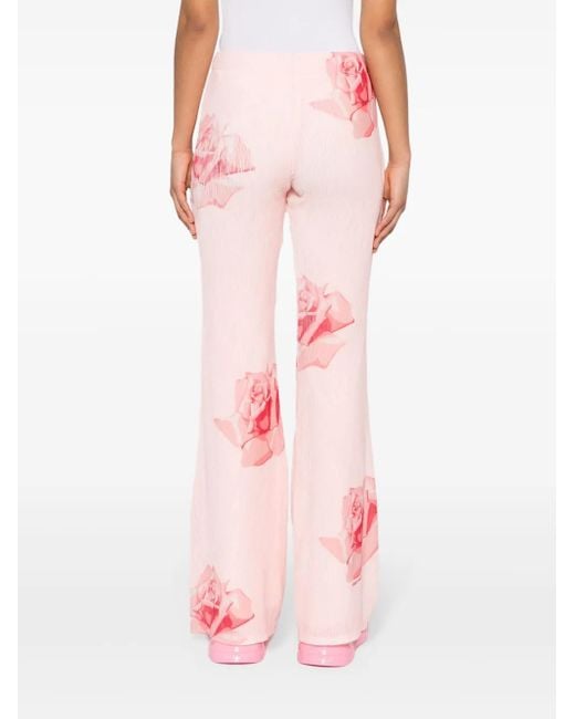Pantalones acampanados con rosa estampada KENZO de color Pink