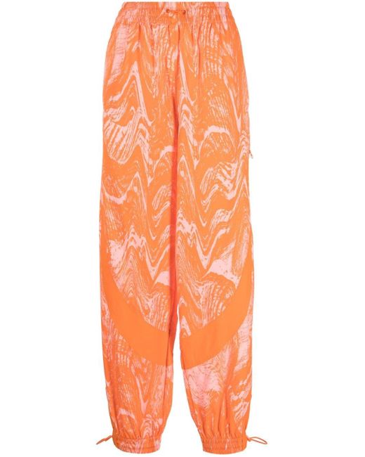Pantaloni sportivi a fiori di adidas By Stella McCartney in Arancione | Lyst