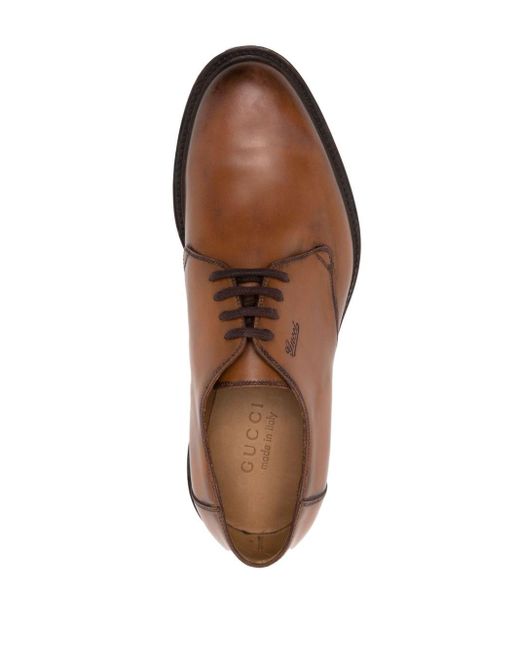 Zapatos Derby con logo en relieve Gucci de hombre de color Brown