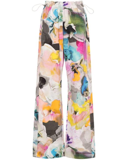 Pantalones rectos con estampado floral Stine Goya de color White