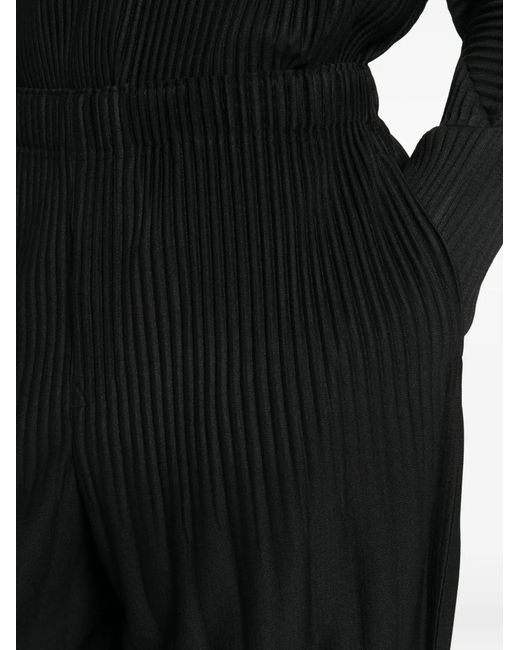 Homme Plissé Issey Miyake Black Plissé-Effect Tapered Trousers for men