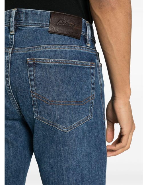 Jeans skinny con placca logo di Brioni in Blue da Uomo