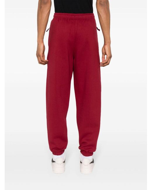Pantaloni affusolati con ricamo di Nike in Red da Uomo