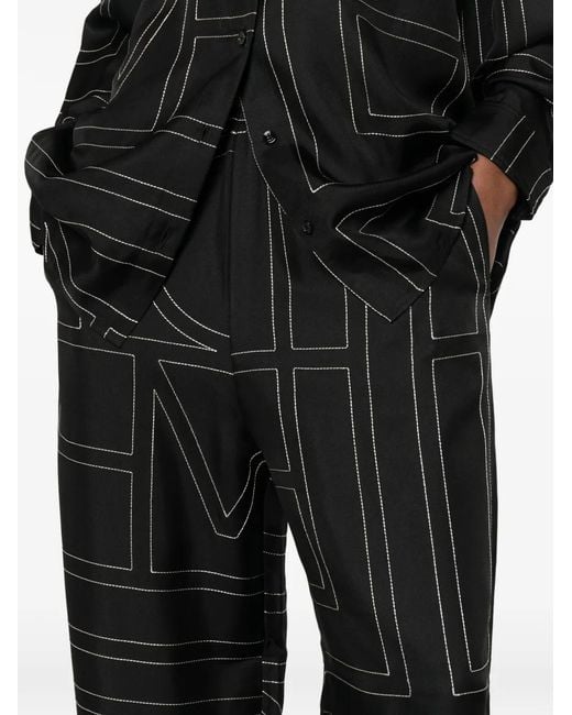 Totême Black Monogram-Print Wide-Leg Trousers