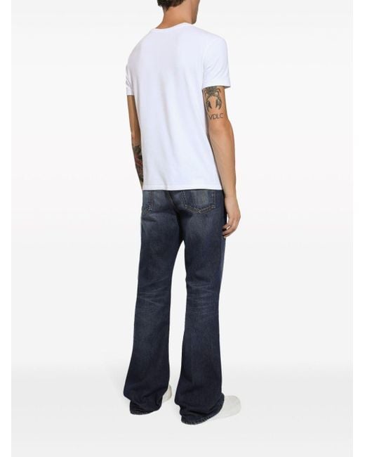 Dolce & Gabbana Lang geschnittene Bootcut-Jeans mit Logo-Applikation in Blue für Herren
