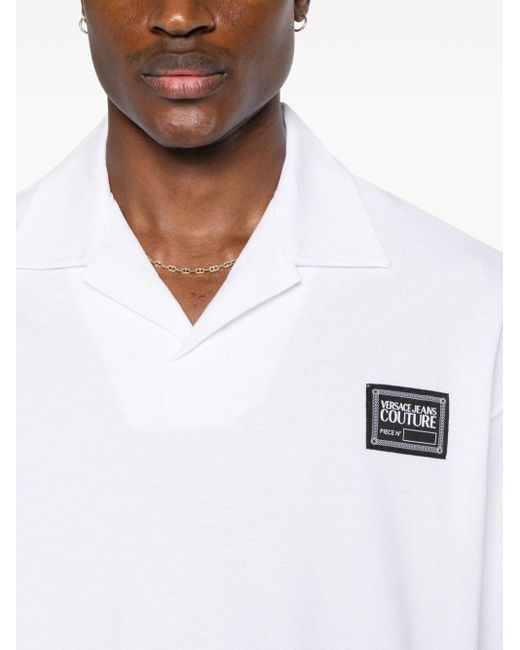 Polo Piece Number à logo Versace pour homme en coloris White