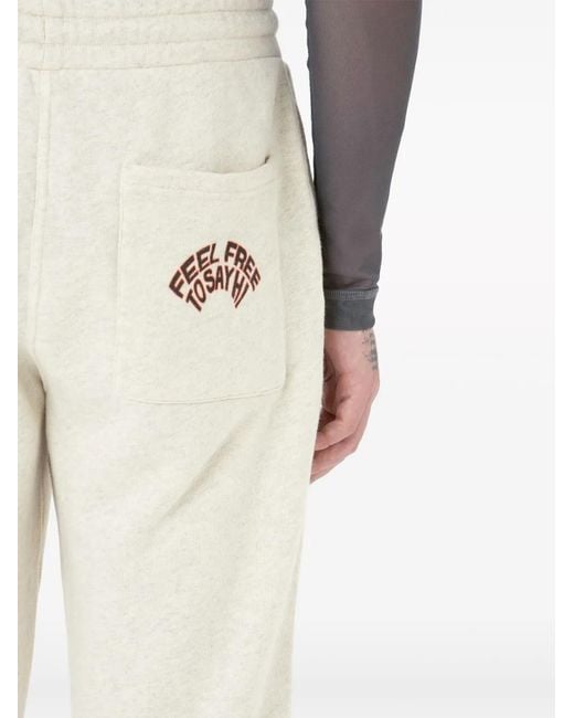 J.W. Anderson Natural Slogan-Embroidered Cotton Track Pants for men