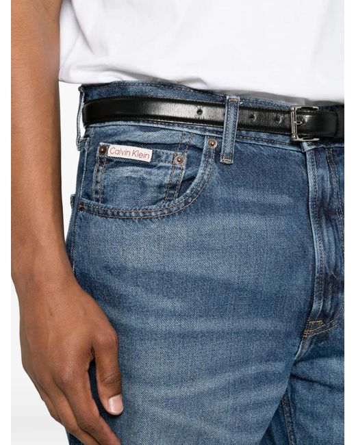 Calvin Klein Blue Logo-Patch Whiskered Jeans for men