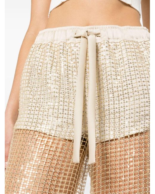 Genny sequinned flared trousers - White