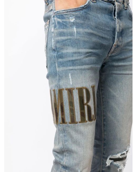 Amiri Blue Light E Ripped Skinny Jeans With Embroidery In Cotton Man for men
