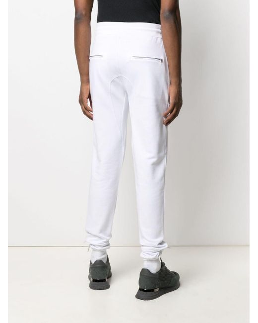 Hombre HUGO BOSS Pantalones de chándal slim fit con detalles reflectantes  Azul oscuro | Chándales | Camminare