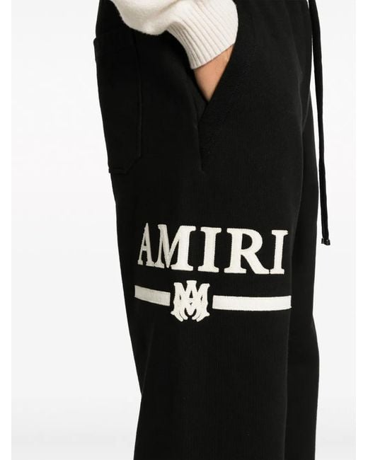 Amiri Black Logo-Engraved Cotton Track Trousers for men