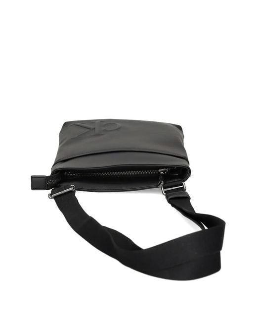 Calvin Klein Black Embossed-Logo Messenger Bag for men