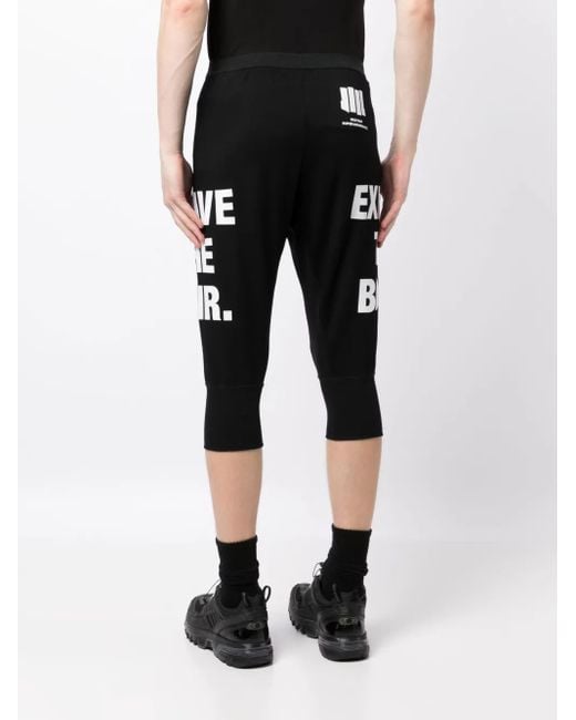 Nils Black Slogan-Print Drop-Crotch Shorts for men