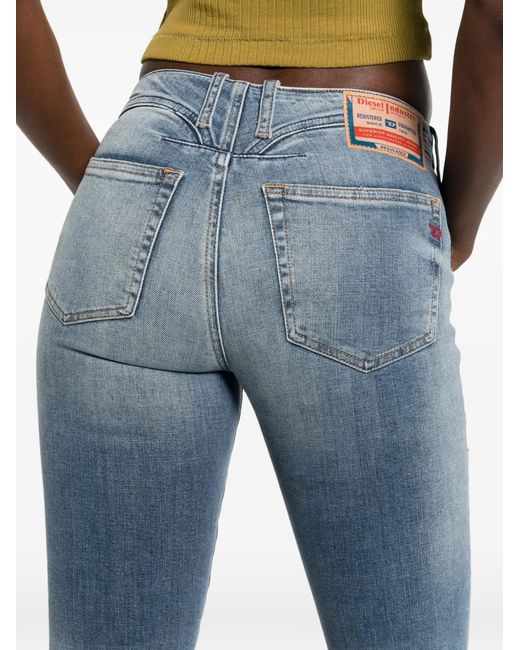 DIESEL Blue Faded Denim Jeans With Flared Silhouette