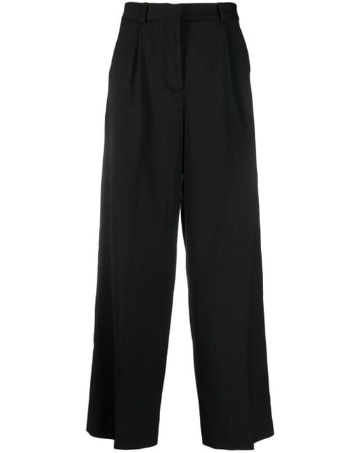 High-waisted wide-leg trousers di Han Kjobenhavn in Black