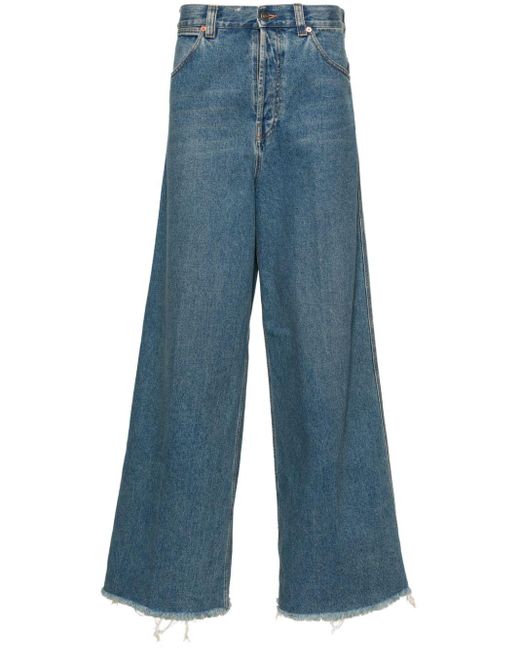Jeans a gamba ampia con applicazione di Gucci in Blue da Uomo