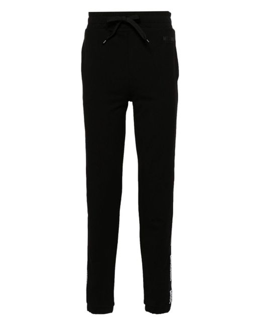 Pantalones de chándal con franja del logo Moschino de hombre de color Black