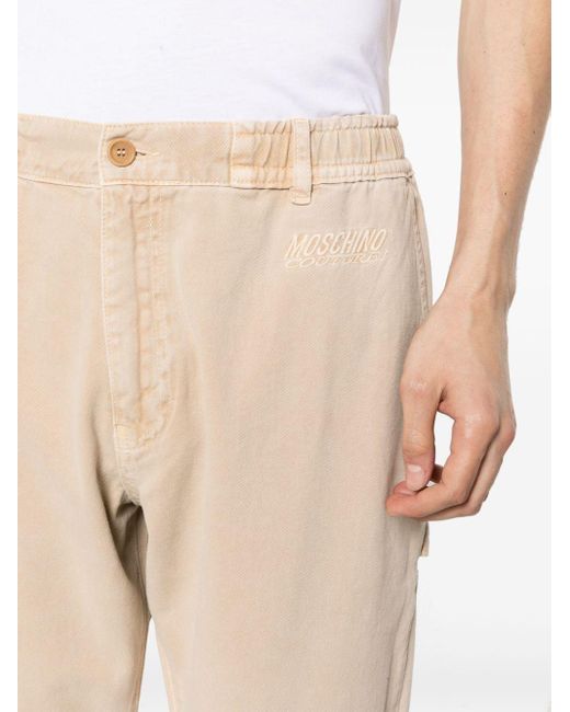 Pantalones ajustados con logo bordado Moschino de hombre de color Natural