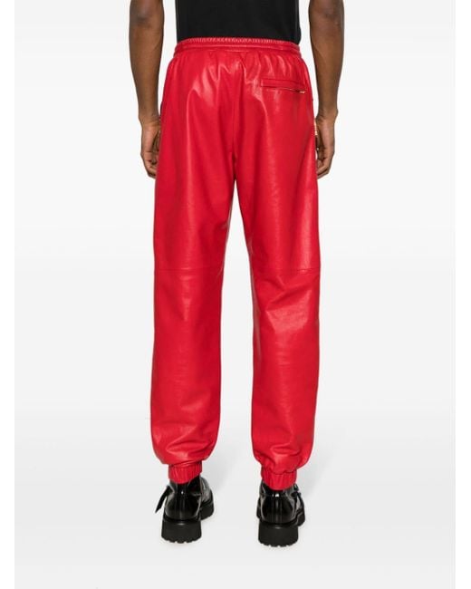 Pantalones de chándal con placa del logo Moschino de hombre de color Red