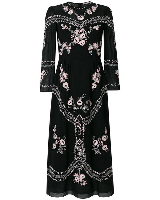 Robe mi-longue à fleurs Vilshenko en coloris Black
