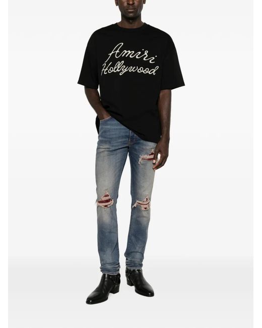 Amiri Blue Distressed Patchwork Jeans for men