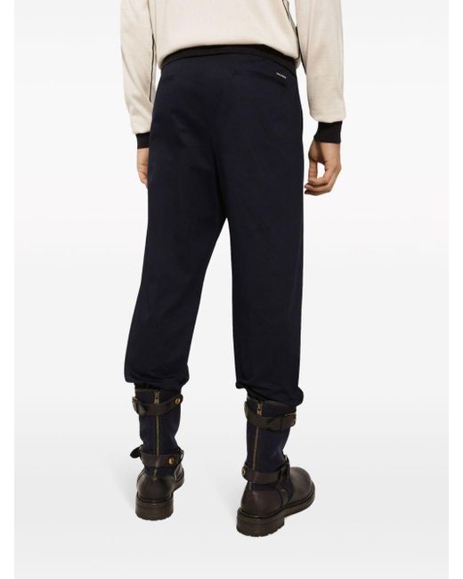 Pantaloni affusolati con applicazione logo di Dolce & Gabbana in Blue da Uomo