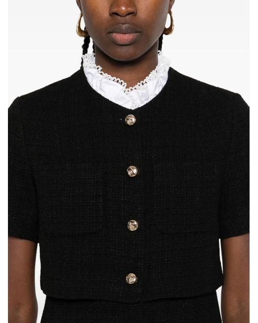 Vestido corto de tweed con detalle de botones Sandro de color Black