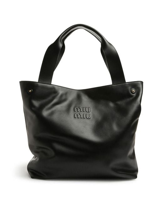 Bolso shopper con logo en relieve Miu Miu de color Black