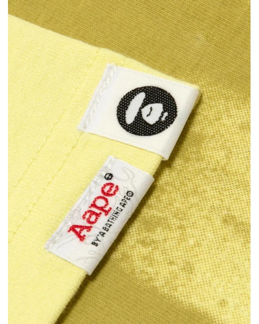 Aape By A Bathing Ape Yellow Aapeunvs Logo-Print Graffiti-Effect T-Shirt for men