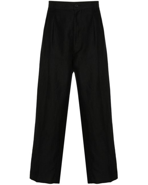 Pantaloni affusolati con pieghe di Comme des Garçons in Black da Uomo