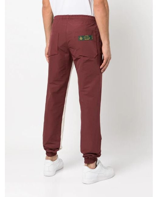 Rhude Red Logo-Patch Stripe-Detail Trackpants for men