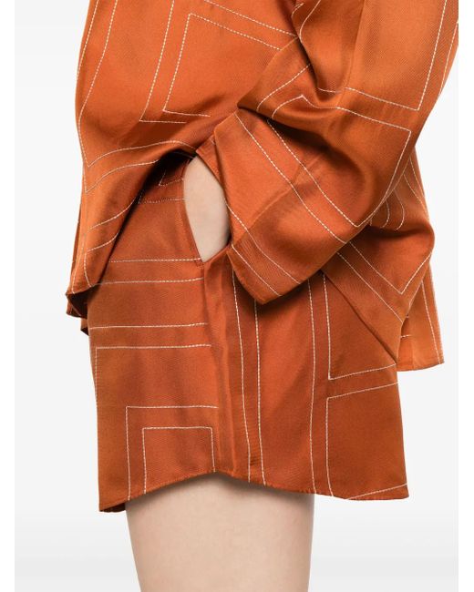 Short En Soie À Motif Monogrammé Totême  en coloris Orange