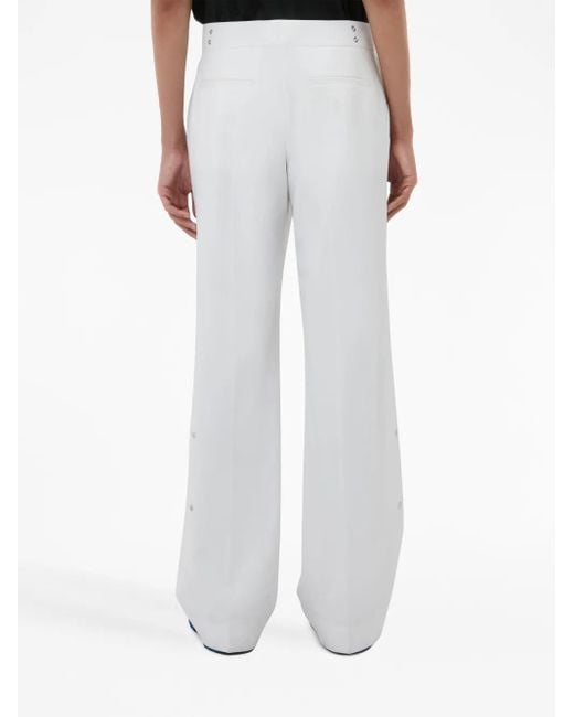 Pantalones rectos con detalle de remaches J.W. Anderson de color White