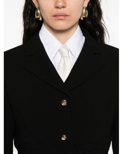 Chaqueta con cinturón Sandro de color Black