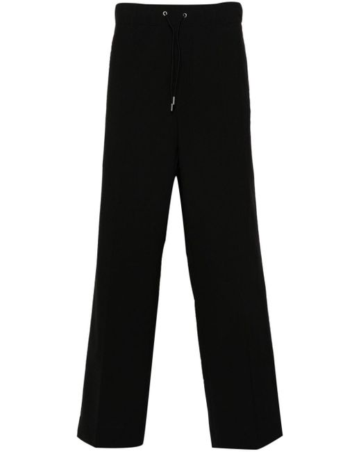 Pantaloni crop a gamba ampia di OAMC in Black da Uomo