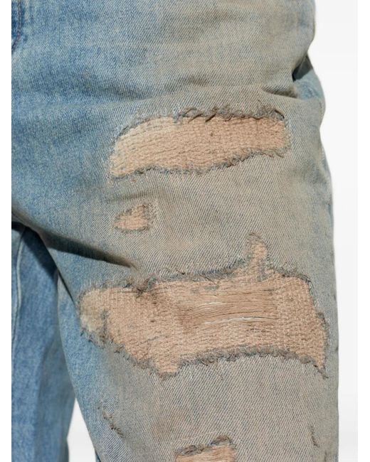 Amiri Blue Distressed Ripped Jeans for men