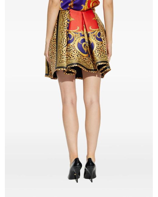 Minijupe À Design Plissé Versace en coloris Yellow