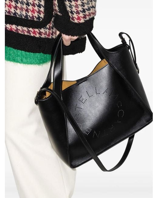 Perforated-Detail Leather Shoulder Bag di Stella McCartney in Black