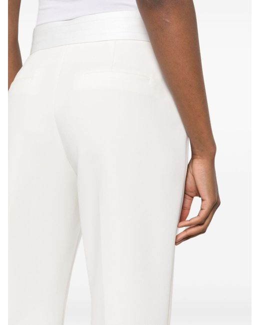 Pantalon de costume à détails satinés Claudie Pierlot en coloris White