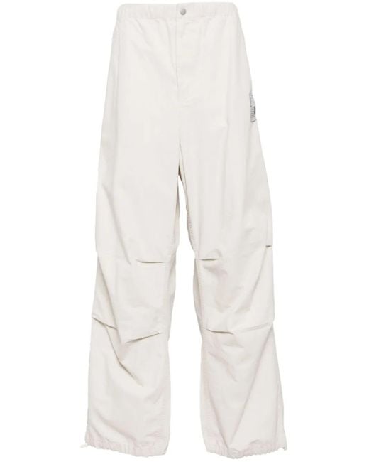 Pantalones Parachute con diseño rasgado Maison Mihara Yasuhiro de hombre de color White