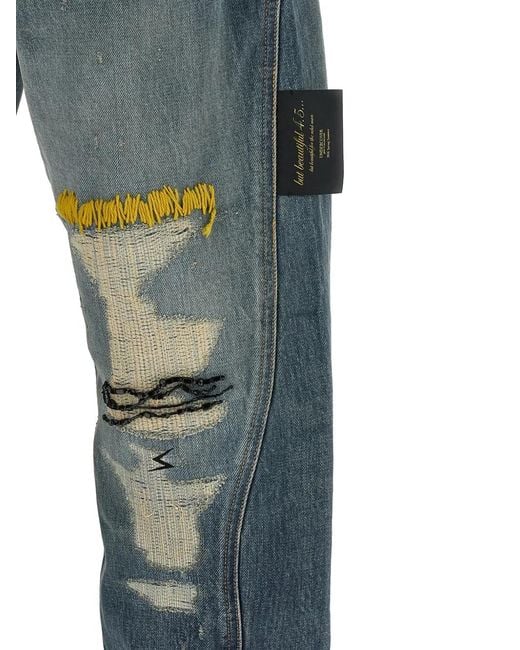 Undercover Blue Embroidered Distressed Jeans for men