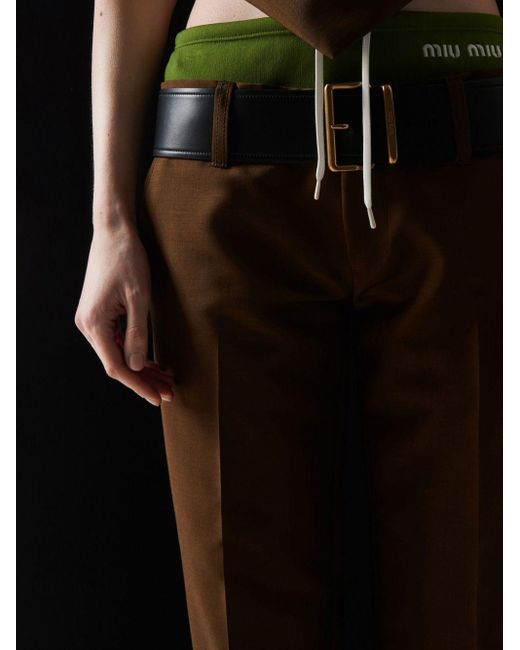 Pantalones con logo bordado Miu Miu de color Brown